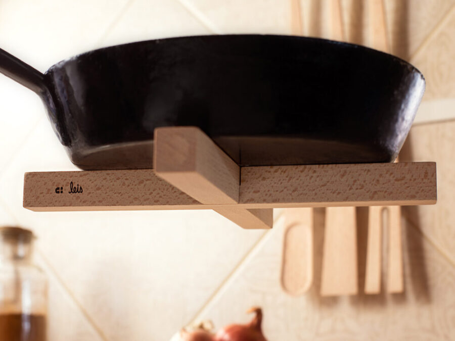 Trivet held against the base of a steel pot by its magnets